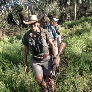 African safari expert Jody Cole (with rifle) leads guests through Kruger National Park in South Africa. (Photo: Robin Lowey)