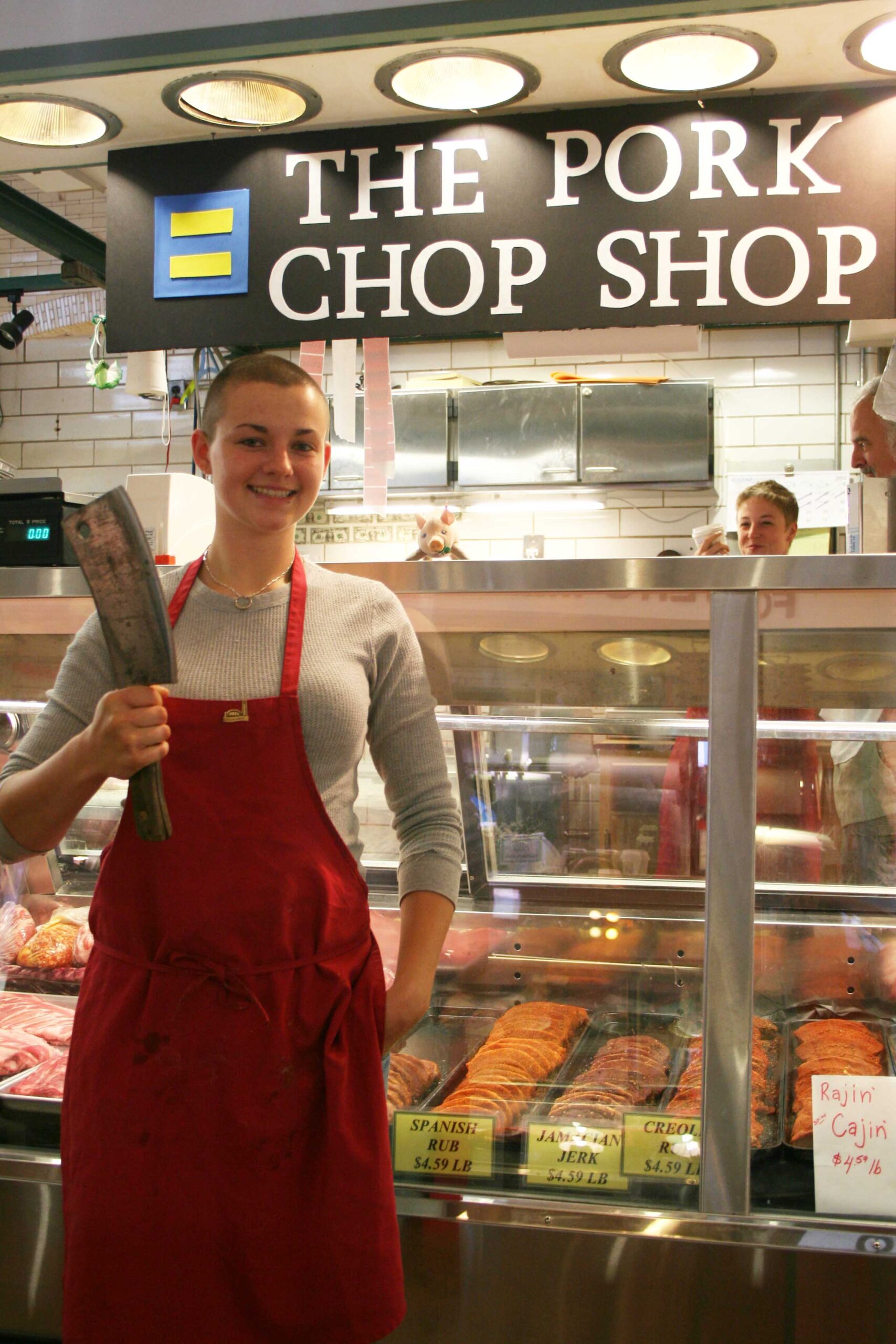 Emma Beno, co-owner of the Pork Chop Shop, stands at the ready at the store located at the famed West Side Market. (Photo: Heather Cassell)