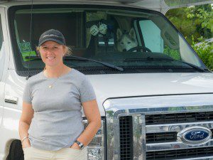 Dawn posing in front of her RV with her dog Nanook in the driver's seat at the Escondido RV Park in Escondido, California. (Photo: Courtesy of Dawn Wilson Photography)