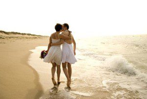 Lesbian brides walk along the beach in Provincetown, Massachusetts. (Photo: Pinterest.com)