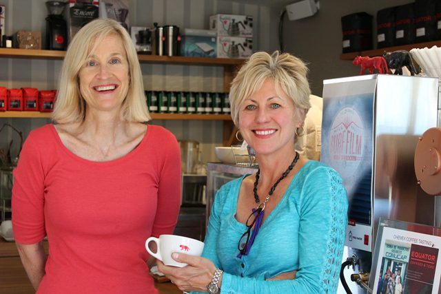 Co-founders of Equator Coffees & Teas Helen Russell, right, and Brooke McDonnell, left, at the Proof Lab Surf Shop location in Mill Valley, California. (Photo: Equator Coffees & Teas / Alex Salkever)
