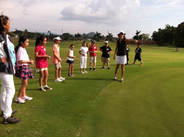 Kellie leading a group of young girl golfers during a day at the junior golf program at Puakea Golf Course. (Photo: Puakea Golf Course)