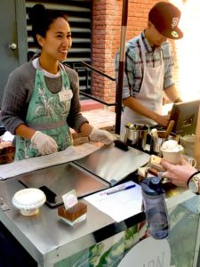 Rica Sunga-Kwan, owner and ice cream maker of Churn Urban Creamery, helps a customer satisfy her sweet tooth. (Photo: Heather Cassell)