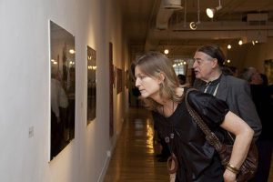 Corinne Erni examining an exhibit.