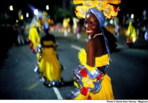 CUBA. Santiago de Cuba. 1998. Costumed dancers on the street during carnival. (Photo: David Alan Harvey / Magnum / Global Exchange Reality Tours*)