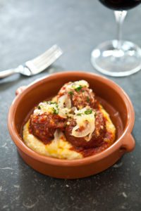 An exquisite meal, like the Prato Meatballs accompanied by roasted tomatoes and cippolini conserva, can be found at Prato in Orlando, Florida. (Photo: Courtesy of Prato)