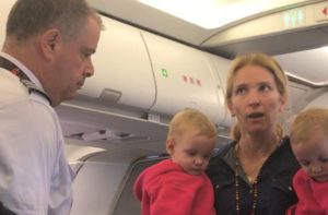 Unidentified woman and her two children speaking with the American Airlines’ captain during Friday’s incident where a flight attendant allegedly nearly struck her child and her with their stroller while boarding a flight from San Francisco International to Dallas-Fort Worth International Airport. (Photo: Facebook)