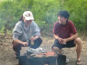 Two campers cooking at Lesbian Summer Camp 2013. (Photo: Courtesy of Lesbian Summer Camp)