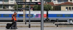 French rail employees SNCF walk along a platform in Saint-Charles railway station (Photo: Courtesy of ABC News)