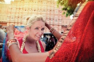 white women being dressed in a sari in Nepal